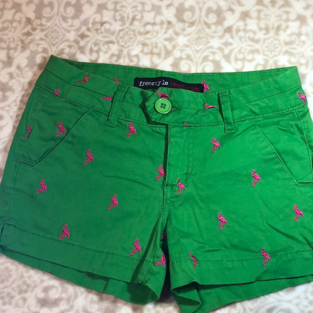 Green shorts with pink flamingos
